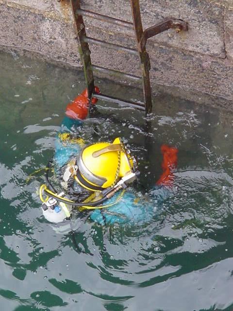 Divers returning from an underwater welding exercise